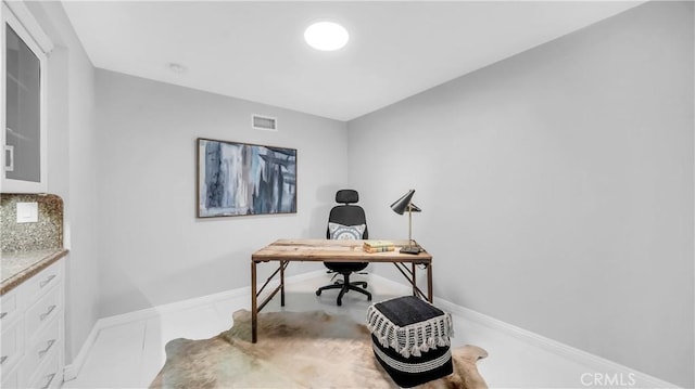 office space featuring visible vents and baseboards