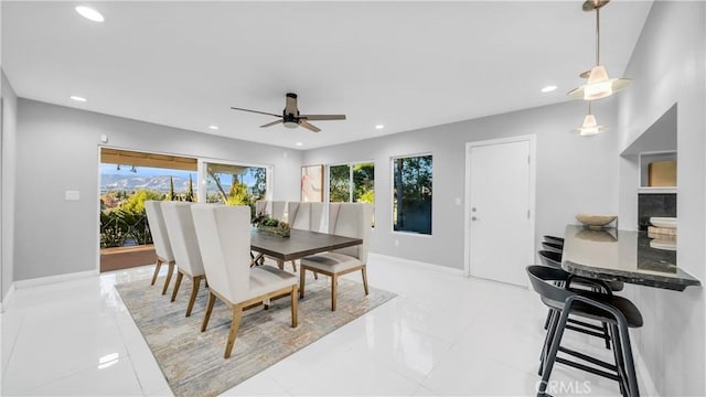 dining area featuring plenty of natural light, recessed lighting, baseboards, and ceiling fan