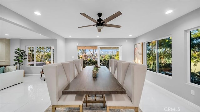 dining room with baseboards, a ceiling fan, and recessed lighting