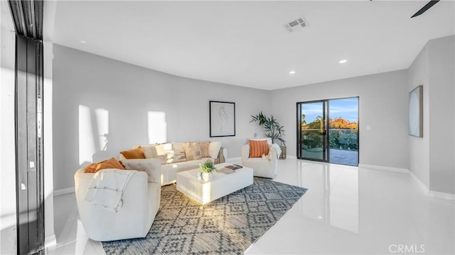 living room featuring visible vents, recessed lighting, and baseboards