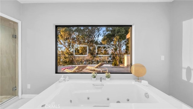 full bath featuring a jetted tub and a shower stall