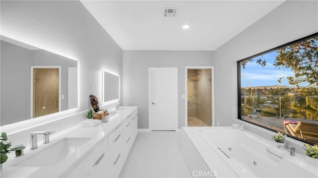bathroom featuring visible vents, a sink, double vanity, walk in shower, and a whirlpool tub