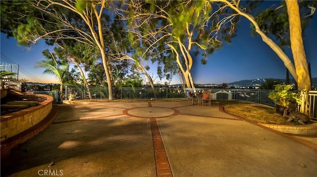 view of home's community with a patio area and fence