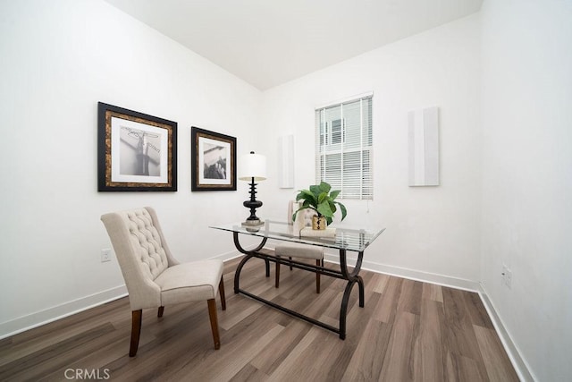 office space with wood finished floors and baseboards