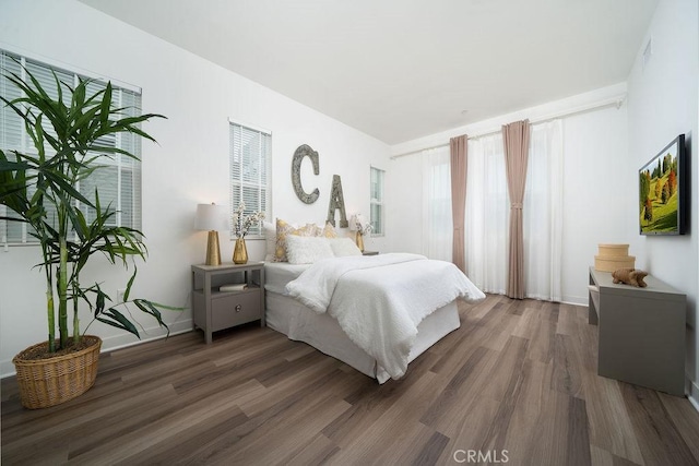 bedroom featuring wood finished floors