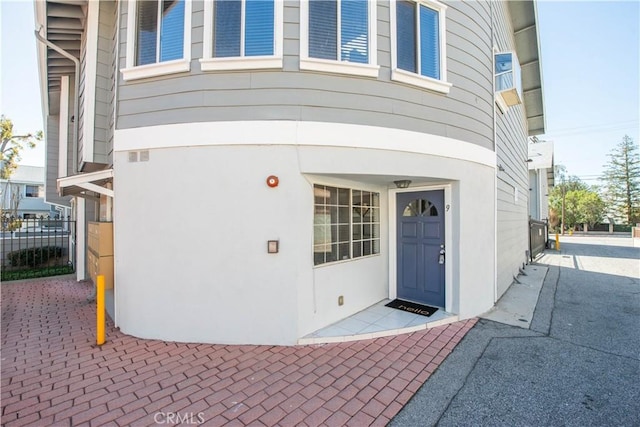 property entrance featuring fence