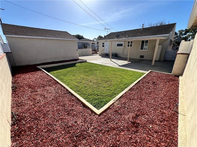 view of yard featuring a fenced backyard and a patio