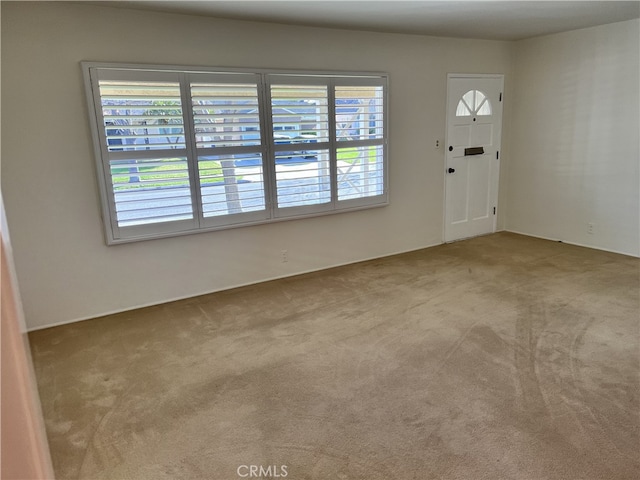 foyer featuring carpet