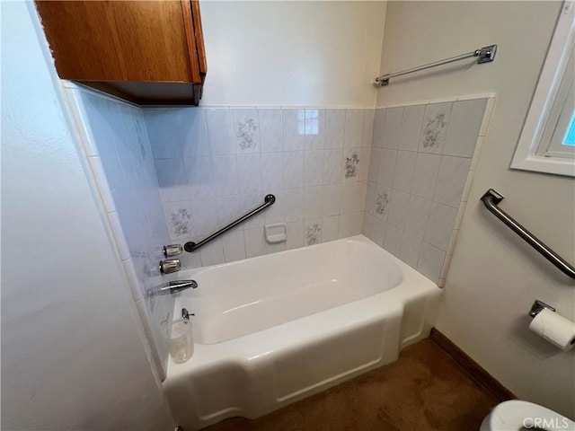 bathroom featuring walk in shower and a bath