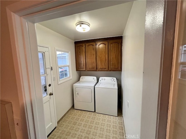 clothes washing area with light floors and washing machine and dryer