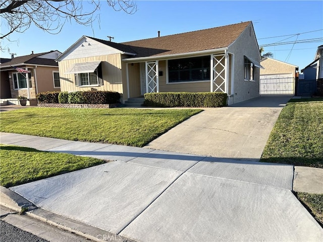 single story home featuring fence and a front lawn