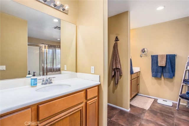 bathroom featuring baseboards, visible vents, tile patterned flooring, vanity, and a shower stall