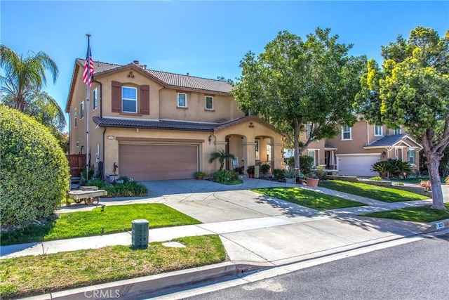 mediterranean / spanish-style home featuring a garage, a tile roof, concrete driveway, stucco siding, and a front lawn