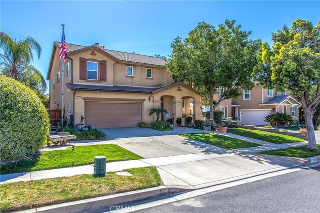 31255 Nice Ave, Mentone, CA 92359 - mediterranean / spanish home with a tile roof, an attached garage, stucco siding, concrete driveway, and a front yard