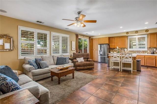 31255 Nice Ave, Mentone, CA 92359 - living room featuring ceiling fan, dark tile patterned floors, and recessed lighting