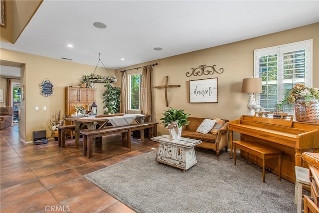 living room featuring visible vents and recessed lighting