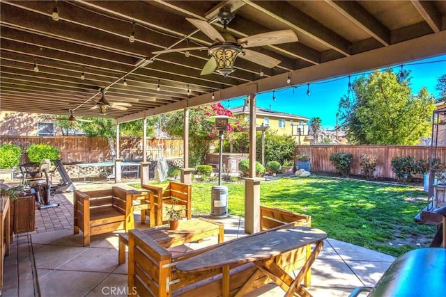 view of patio / terrace with ceiling fan, a fenced backyard, and outdoor dining area