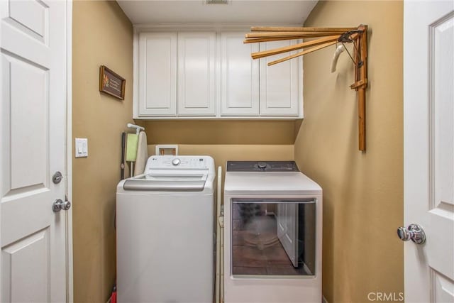 31255 Nice Ave, Mentone, CA 92359 - washroom with washing machine and clothes dryer and cabinet space