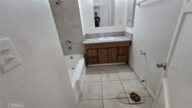 bathroom featuring bathtub / shower combination, tile patterned flooring, and vanity