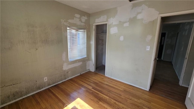 empty room with wood finished floors