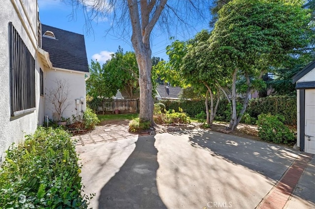 view of patio / terrace featuring fence