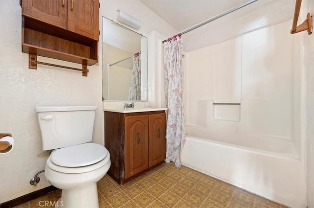 bathroom featuring tile patterned floors, vanity, toilet, and shower / bath combo with shower curtain