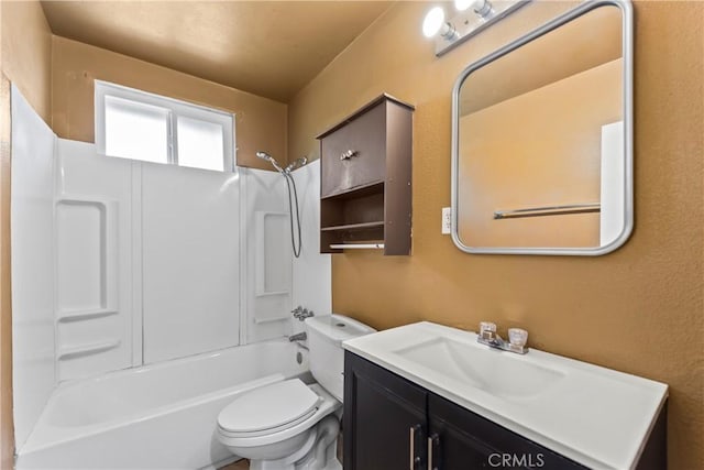 bathroom with toilet, shower / tub combination, and vanity