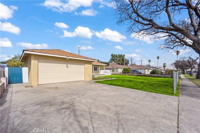 view of front of property with a front yard, fence, and stucco siding