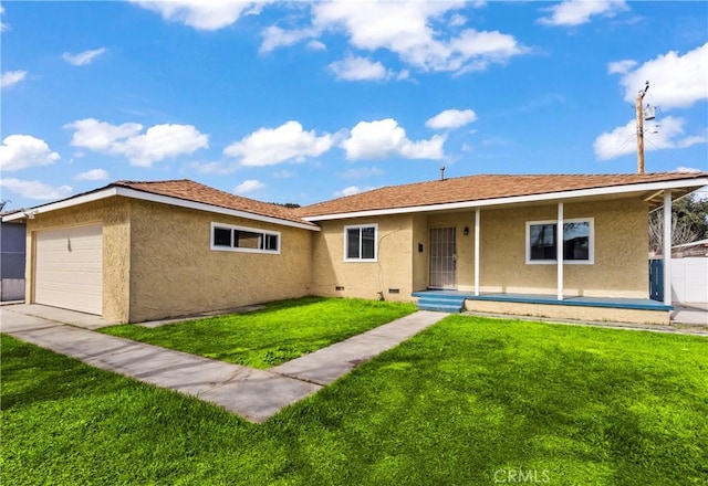 ranch-style house featuring a front lawn, an attached garage, and stucco siding