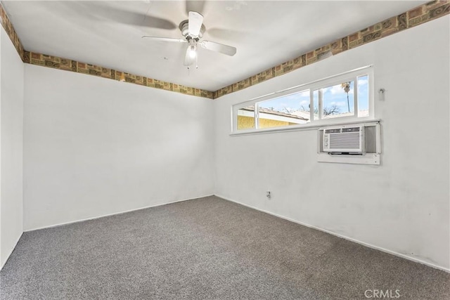 spare room featuring carpet floors, cooling unit, and ceiling fan