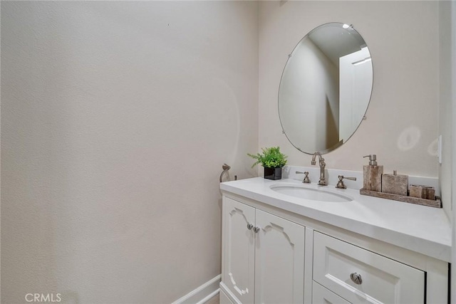 bathroom featuring vanity and baseboards