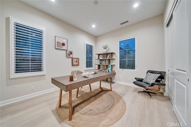 home office featuring recessed lighting, baseboards, visible vents, and light wood finished floors