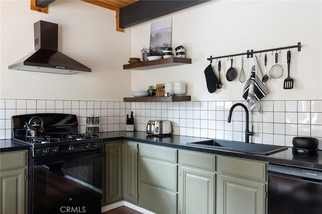 kitchen with dark countertops, decorative backsplash, a sink, black appliances, and wall chimney exhaust hood