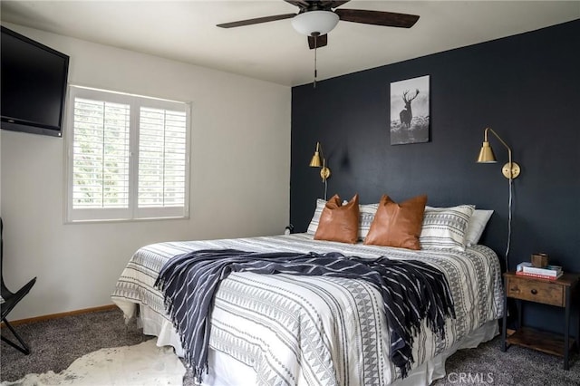 bedroom featuring ceiling fan, carpet flooring, and baseboards