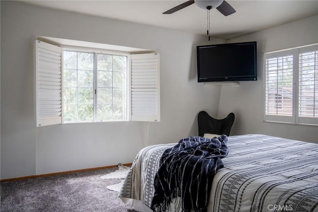 bedroom with carpet floors, baseboards, and a ceiling fan