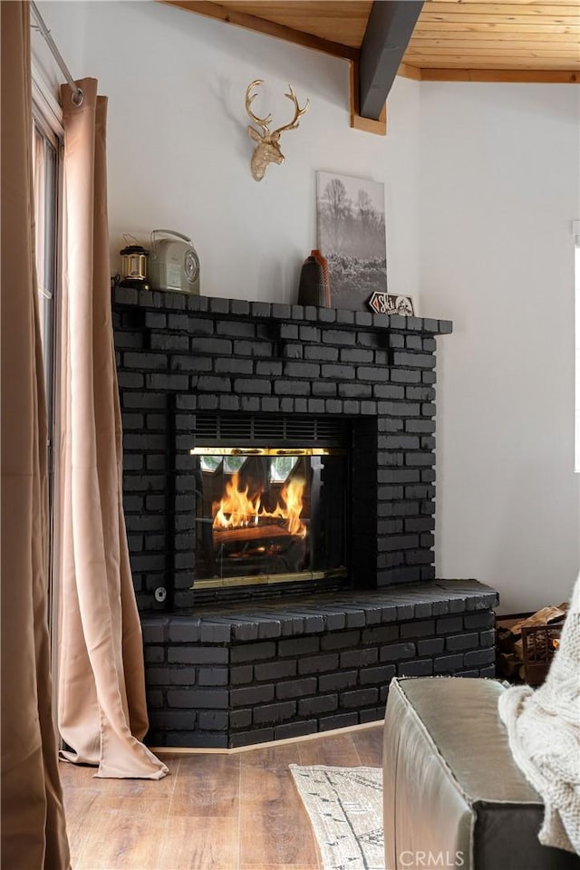 room details with a brick fireplace and wood finished floors