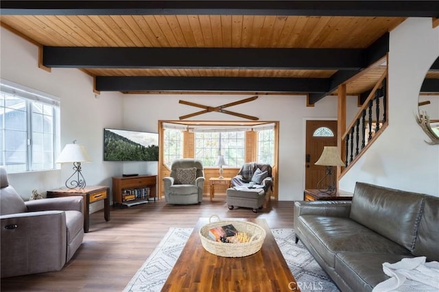 living room featuring wooden ceiling, stairway, wood finished floors, and beamed ceiling