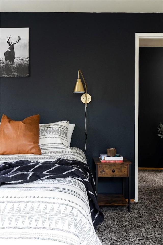 carpeted bedroom featuring baseboards