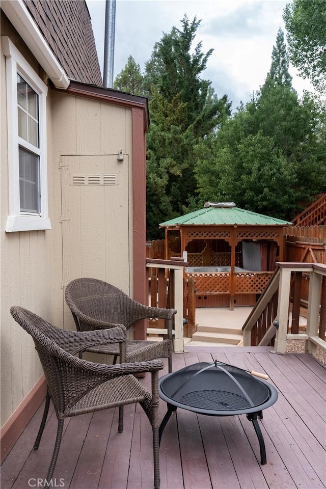 wooden terrace with fence and a gazebo