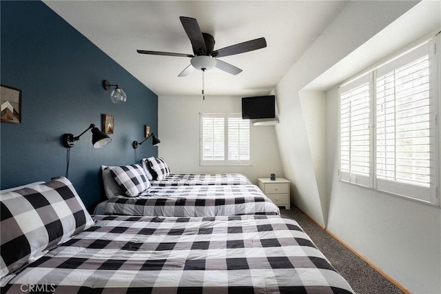 carpeted bedroom with a ceiling fan