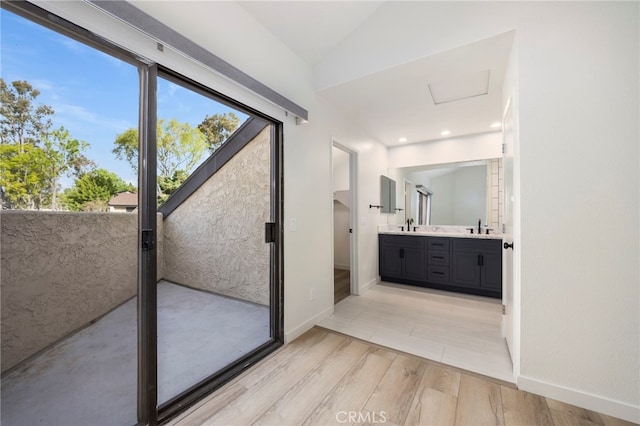 3635 Sierra Cir Unit 22, West Covina, CA 91792 - full bathroom with vaulted ceiling, double vanity, wood finished floors, and a sink
