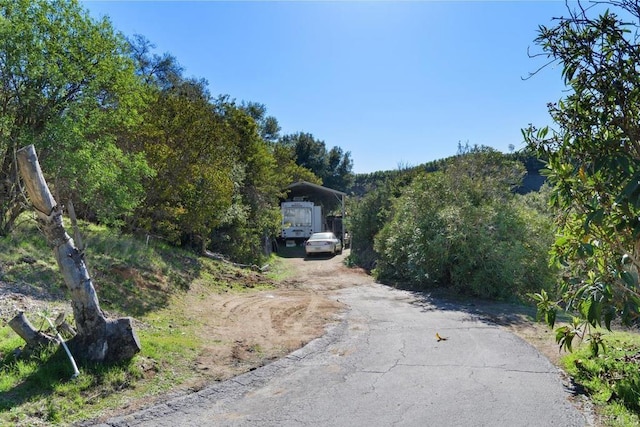 39255 De Luz Rd, Fallbrook, CA 92028 - view of asphalt driveway featuring a forest view