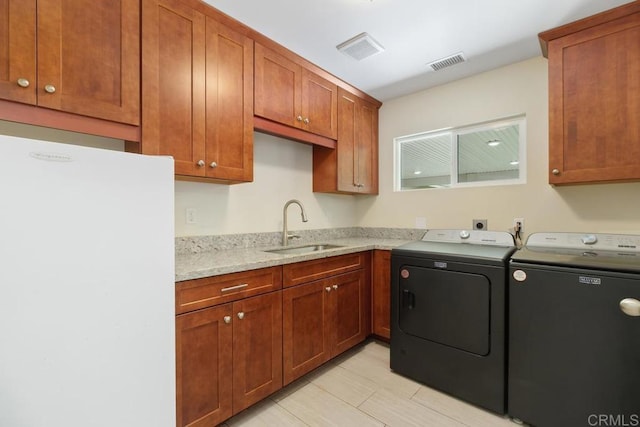 39255 De Luz Rd, Fallbrook, CA 92028 - laundry room featuring washer and clothes dryer and cabinet space