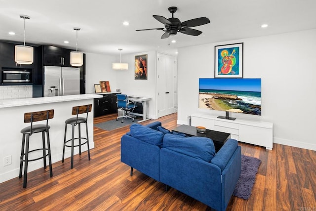 living area featuring dark wood-style floors, recessed lighting, ceiling fan, and baseboards