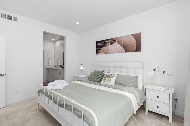 bedroom with visible vents, baseboards, ensuite bath, carpet, and recessed lighting