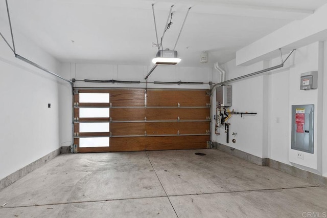 garage featuring a garage door opener, electric panel, and baseboards