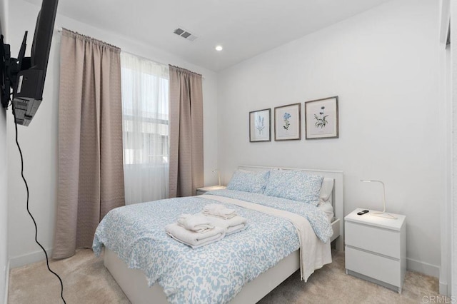 bedroom featuring light carpet, baseboards, visible vents, and recessed lighting