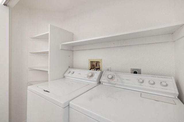 laundry room featuring washing machine and clothes dryer