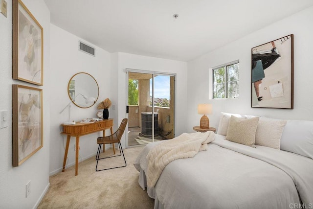 bedroom with access to exterior, baseboards, visible vents, and light colored carpet