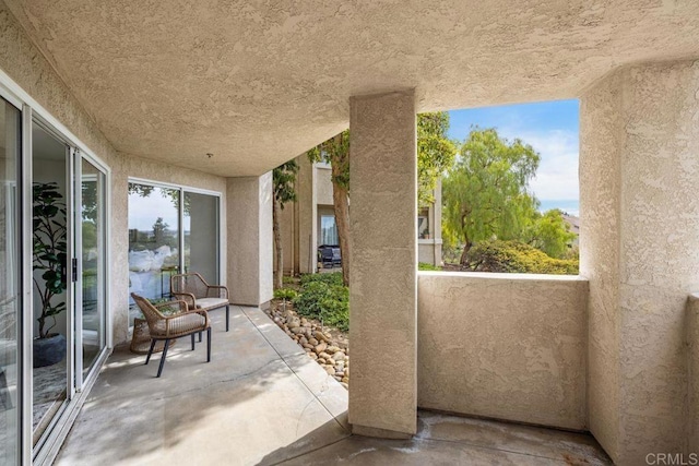 view of patio with a balcony